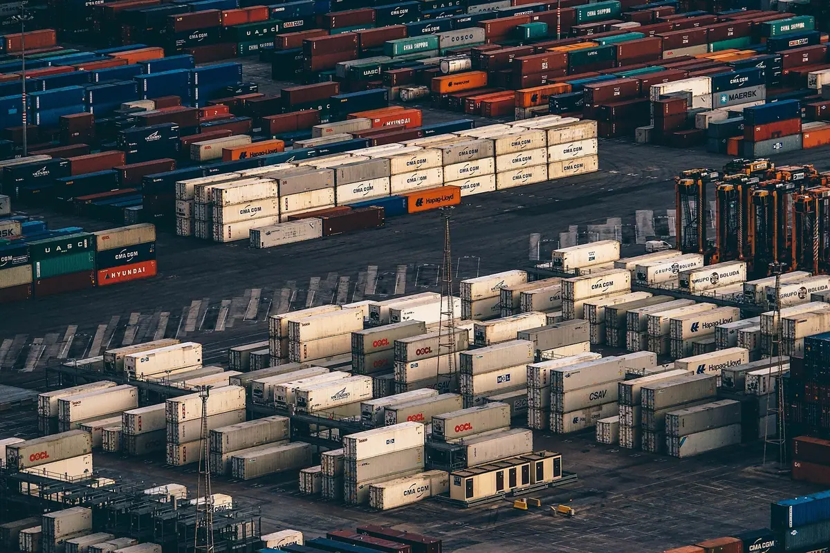 Shipping containers at the Port of Barcelona, illustrating international supply-chain research.
