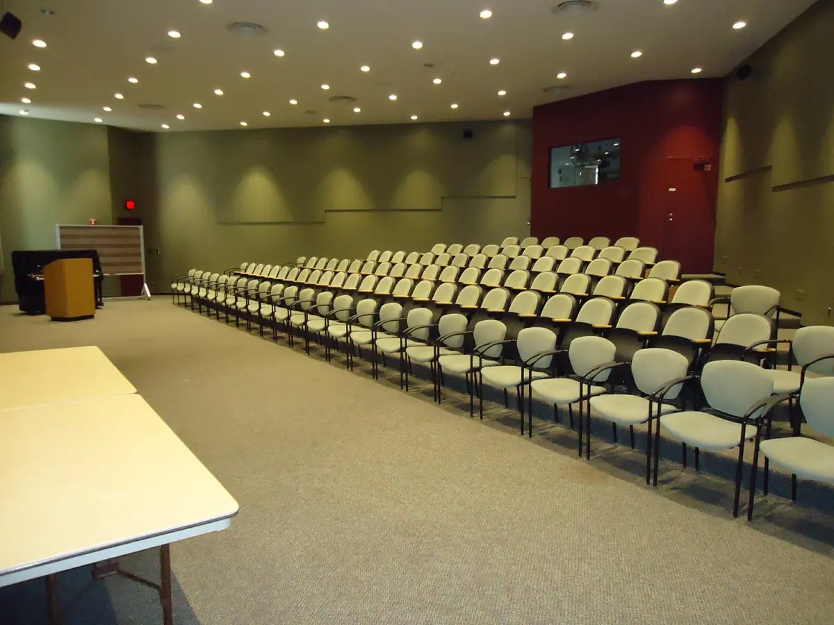 Audience seated for an academic seminar in a university auditorium.