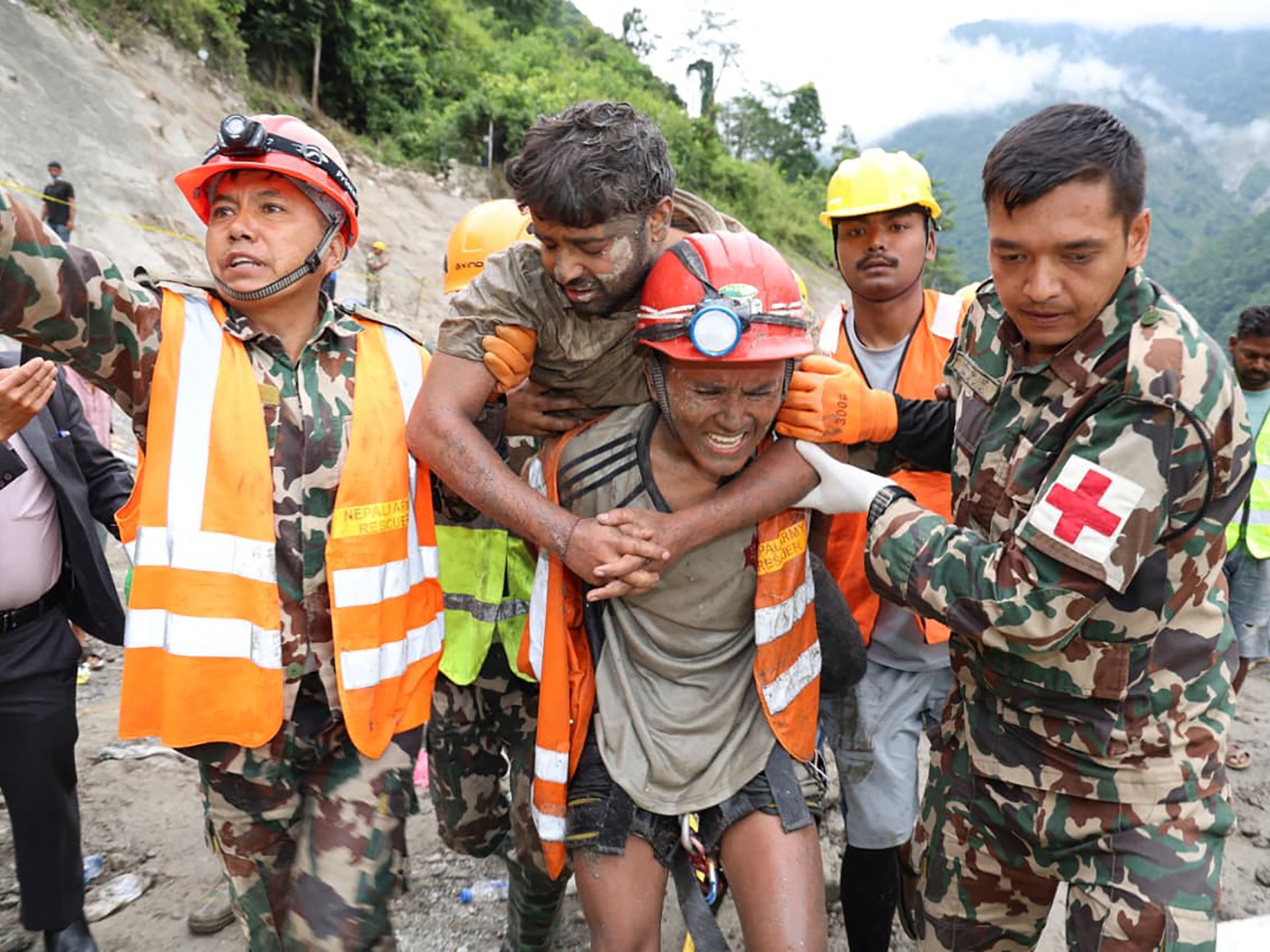 Nepal army personnel carry a worker rescued from a tunnel at the Trishuli-3A Hydropower Project on September 4, 2026 [AFP]
